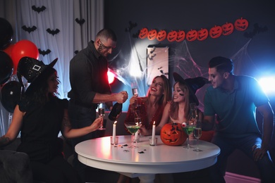 Group of friends having Halloween party at home