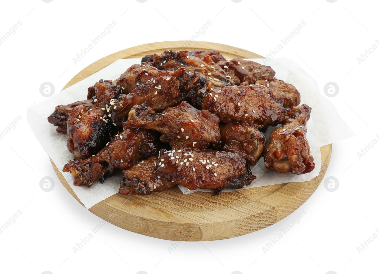 Photo of Wooden board with tasty roasted chicken wings isolated on white