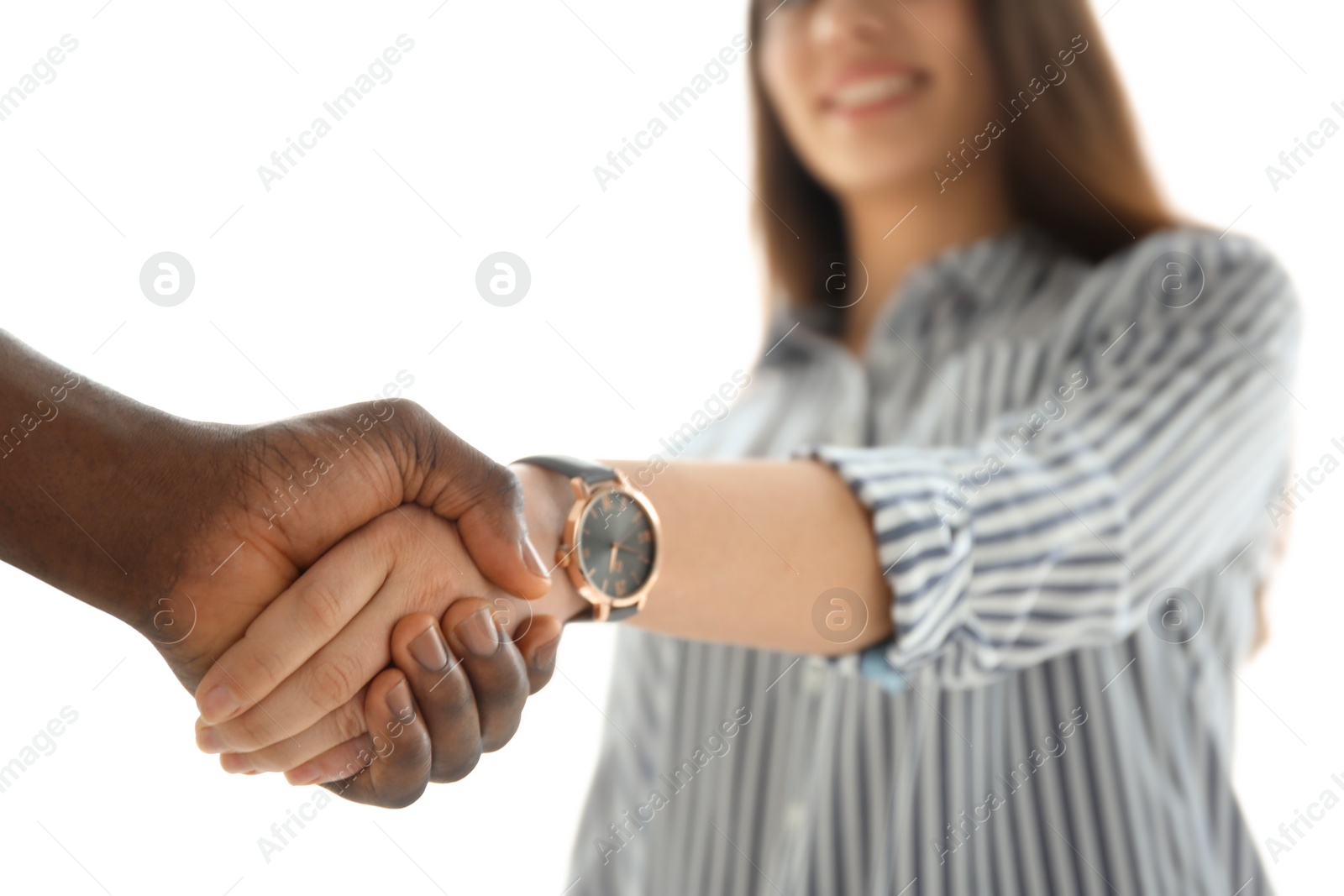 Photo of Man and woman shaking hands on light background, closeup. Unity concept