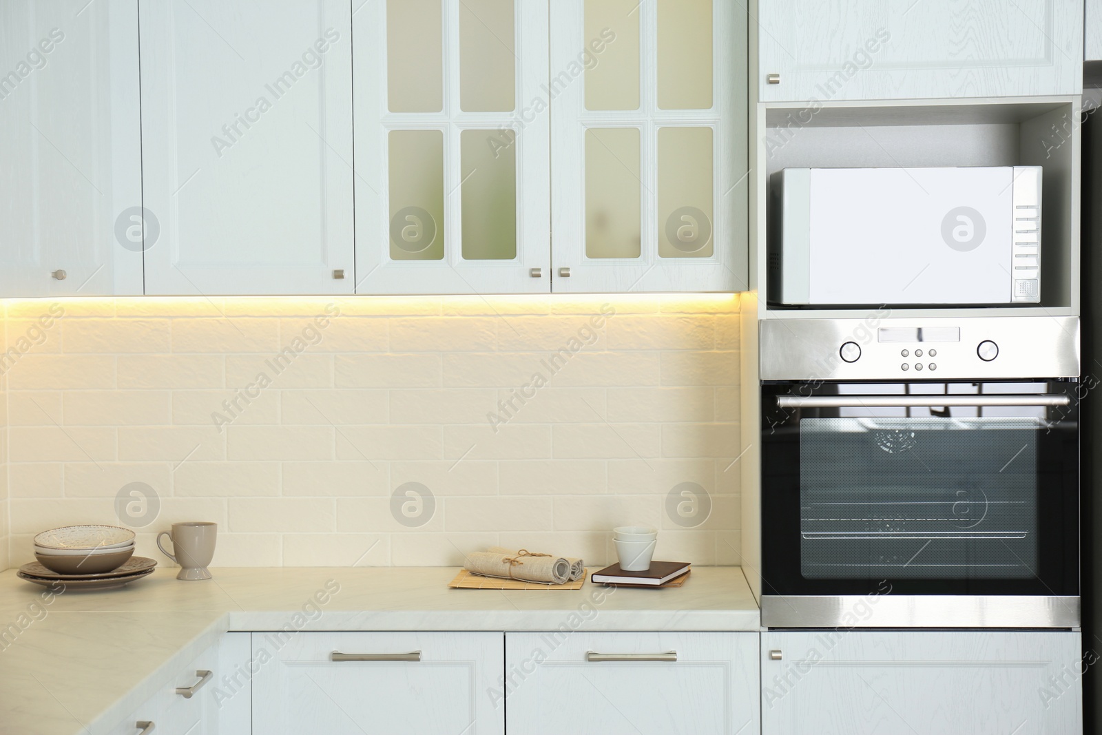 Photo of Beautiful kitchen interior with new stylish furniture