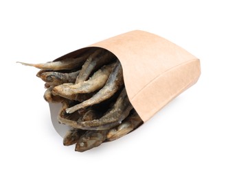 Photo of Paper bag with delicious fried anchovies on white background