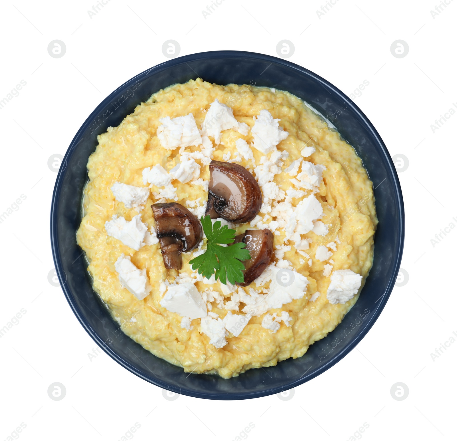 Photo of Tasty banosh with brynza and mushrooms in bowl isolated on white, top view. Traditional Ukrainian dish