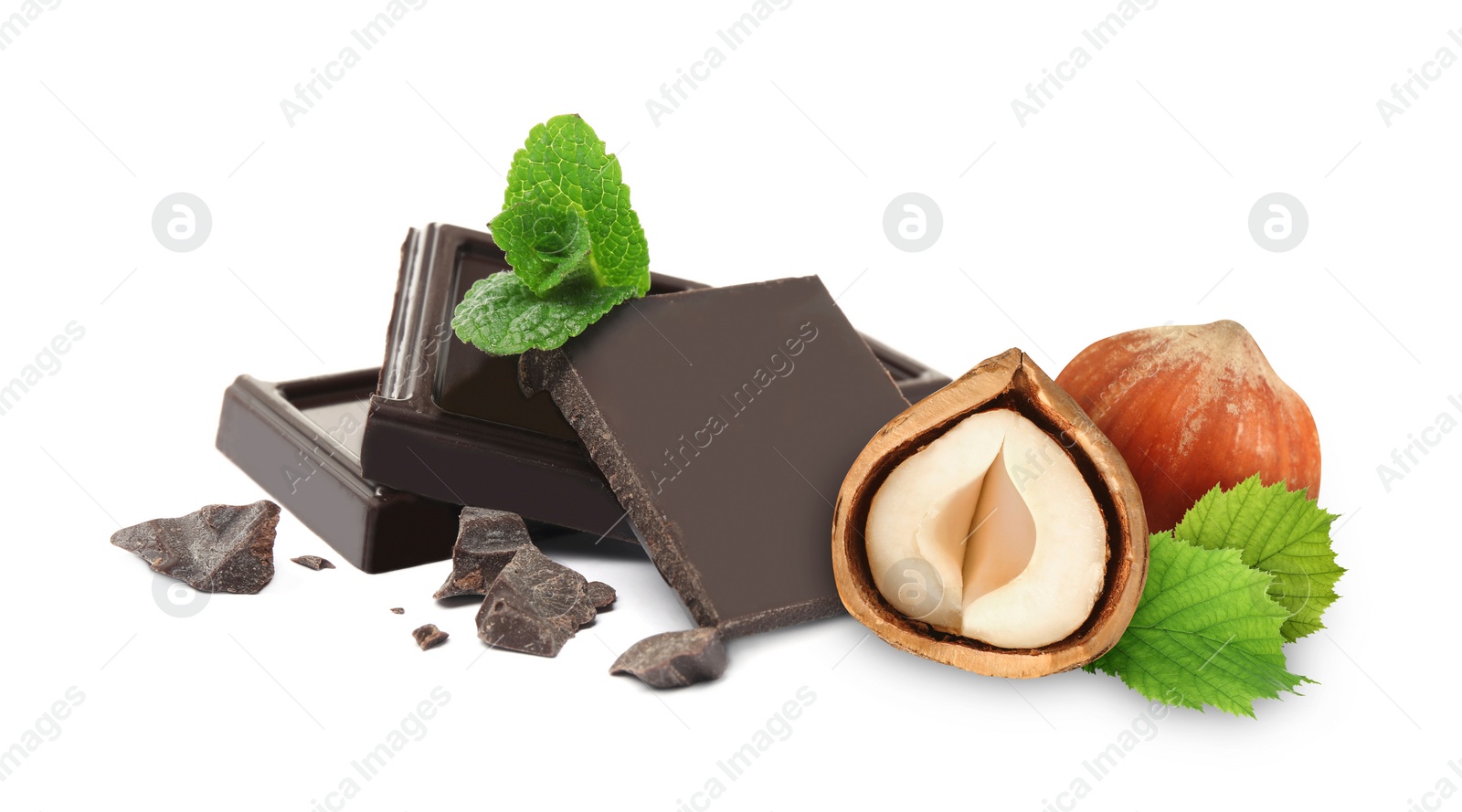 Image of Dark chocolate and hazelnuts isolated on white