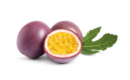 Delicious passion fruits (maracuya) and green leaf on white background