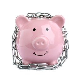 Photo of Piggy bank with steel chain isolated on white. Money safety concept