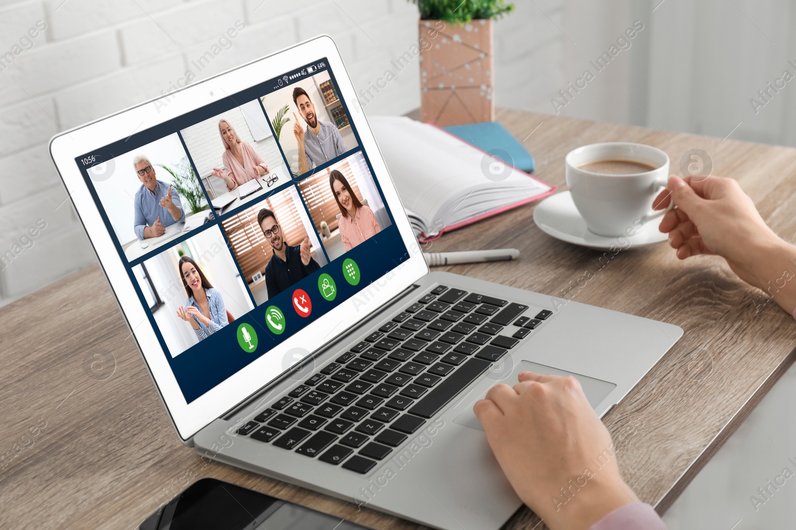 Image of Woman having video chat with colleagues at table in office, closeup. Team work 