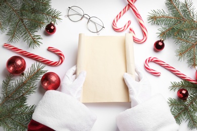 Photo of Santa with letter at white table, top view