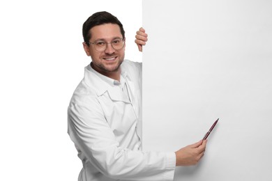 Photo of Ophthalmologist pointing at blank banner on white background, space for text