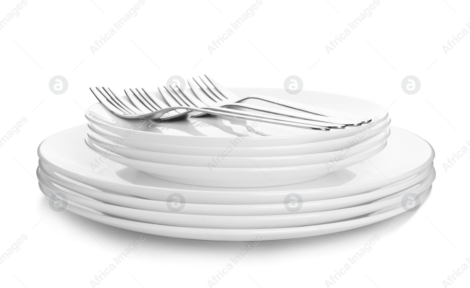 Photo of Stack of plates with forks on white background