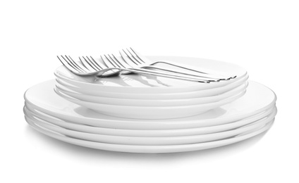 Photo of Stack of plates with forks on white background