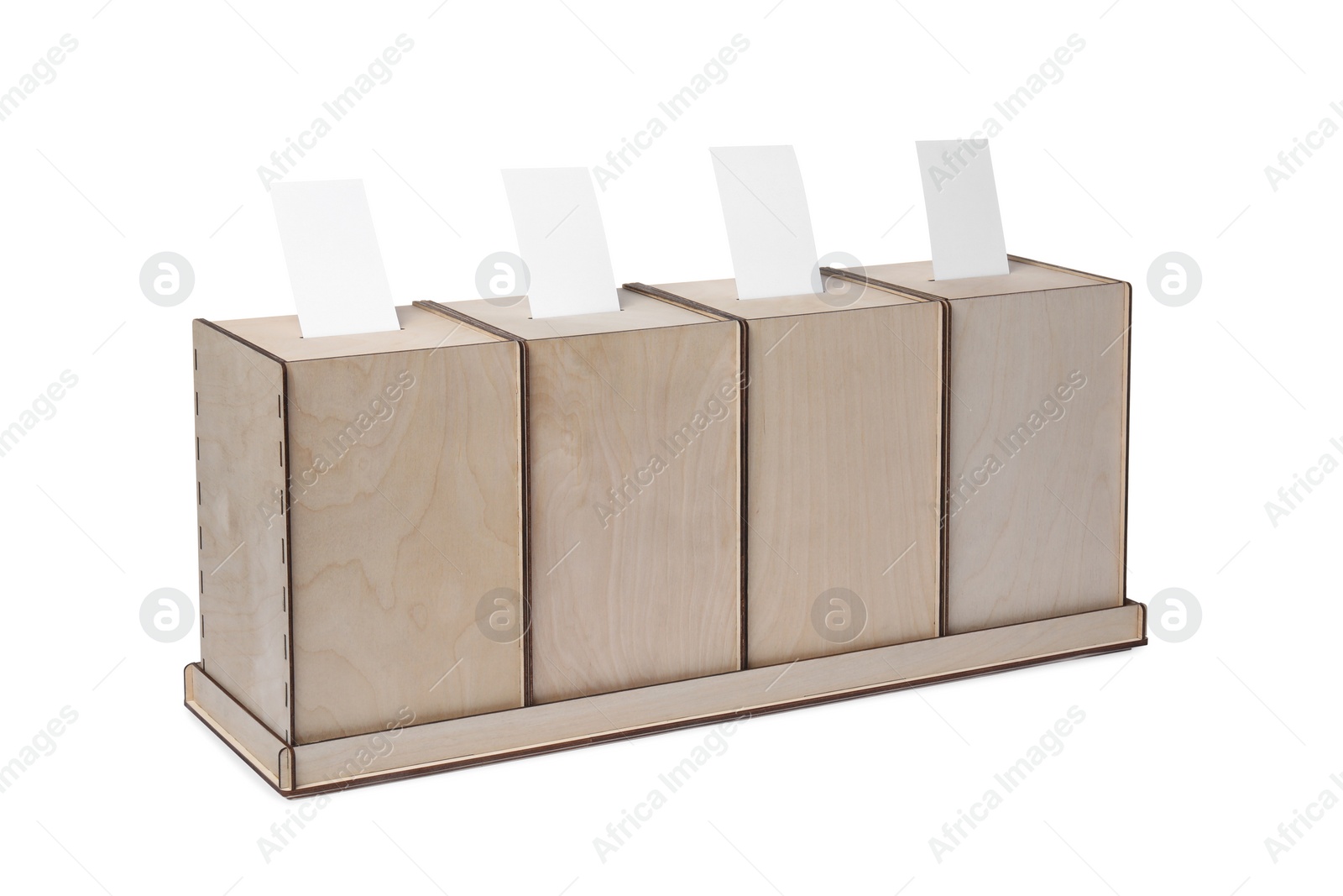 Photo of Wooden ballot boxes with votes isolated on white