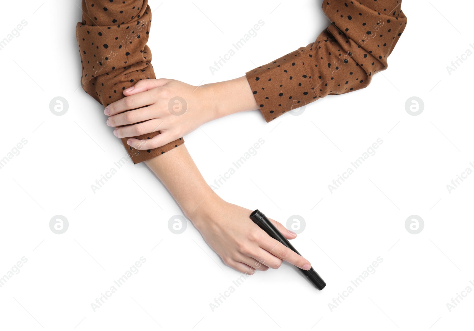 Photo of Woman with marker on white background, top view. Closeup of hands