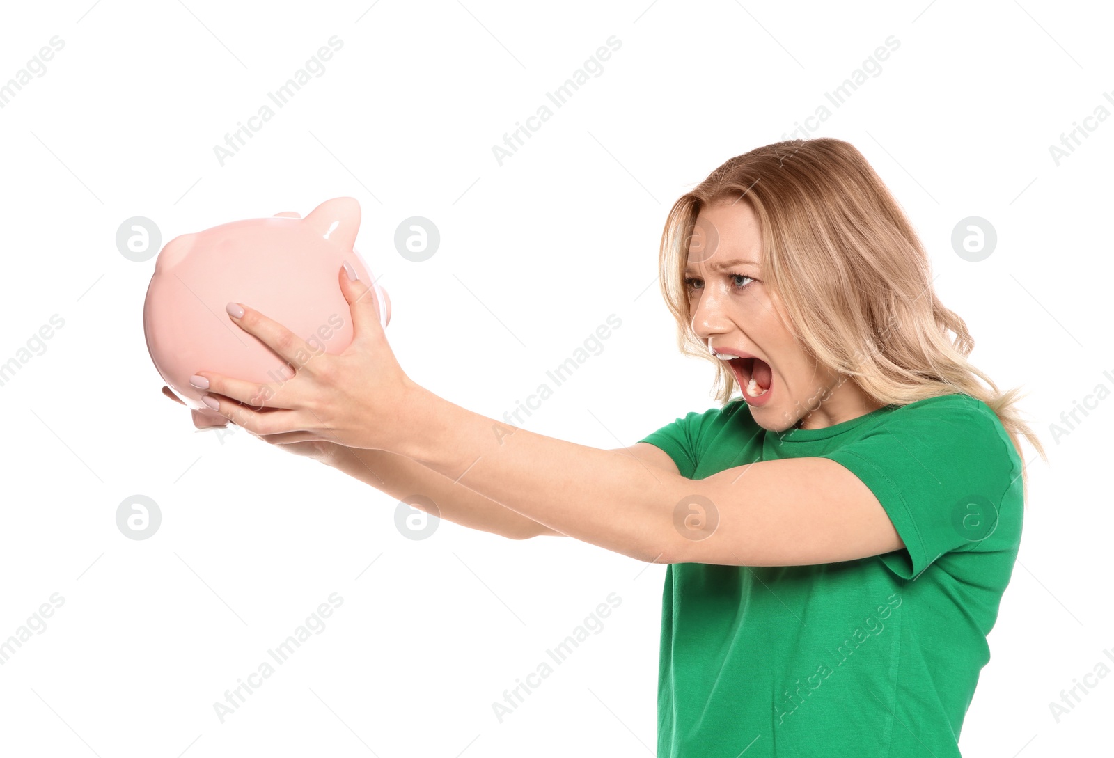Photo of Emotional young woman with piggy bank on white background