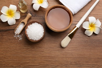 Photo of Flat lay composition with cosmetic product for spa body wraps on wooden background
