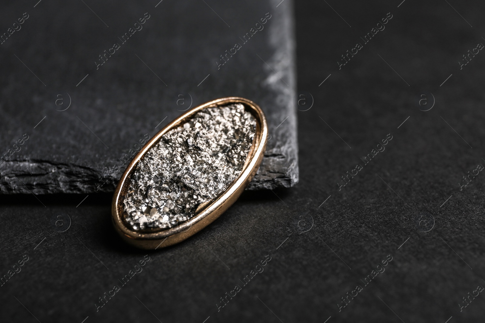 Photo of Stylish brooch on black background, space for text. Luxury jewelry