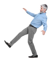 Mature businessman in stylish clothes posing on white background