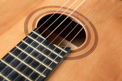 Photo of Beautiful classical guitar, closeup view. Musical instrument