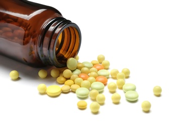 Photo of Bottle with vitamin pills on white background