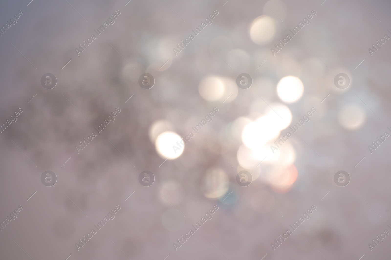 Photo of Shiny lilac background with magical bokeh effect