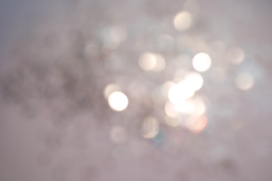 Photo of Shiny lilac background with magical bokeh effect