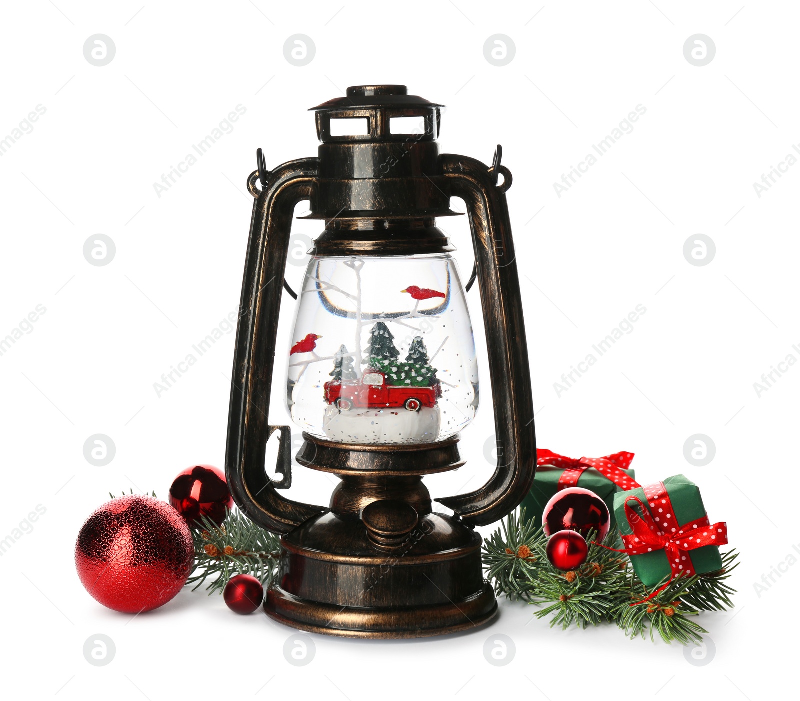 Photo of Beautiful snow globe in vintage lantern and Christmas decor on white background