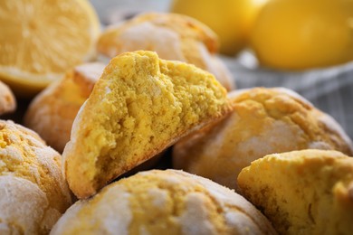 Photo of Many delicious lemon cookies on towel, closeup