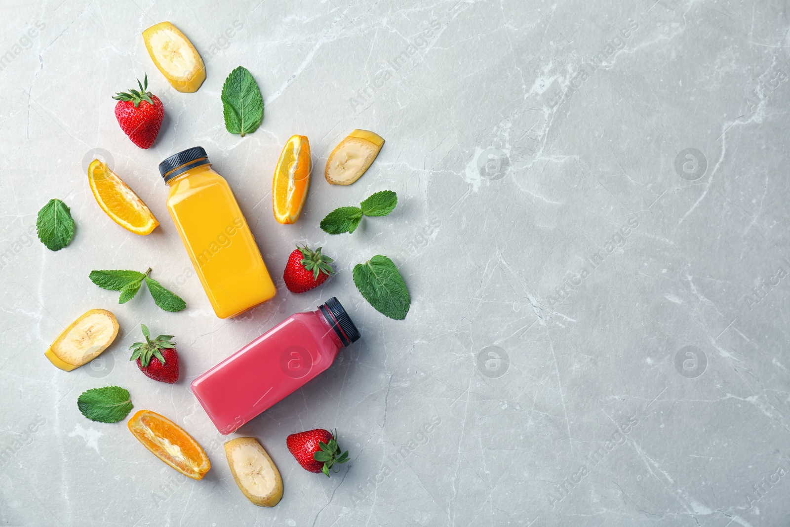 Photo of Flat lay composition with tasty juices and ingredients on light background