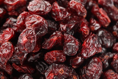Photo of Pile of tasty dried cranberries as background, closeup