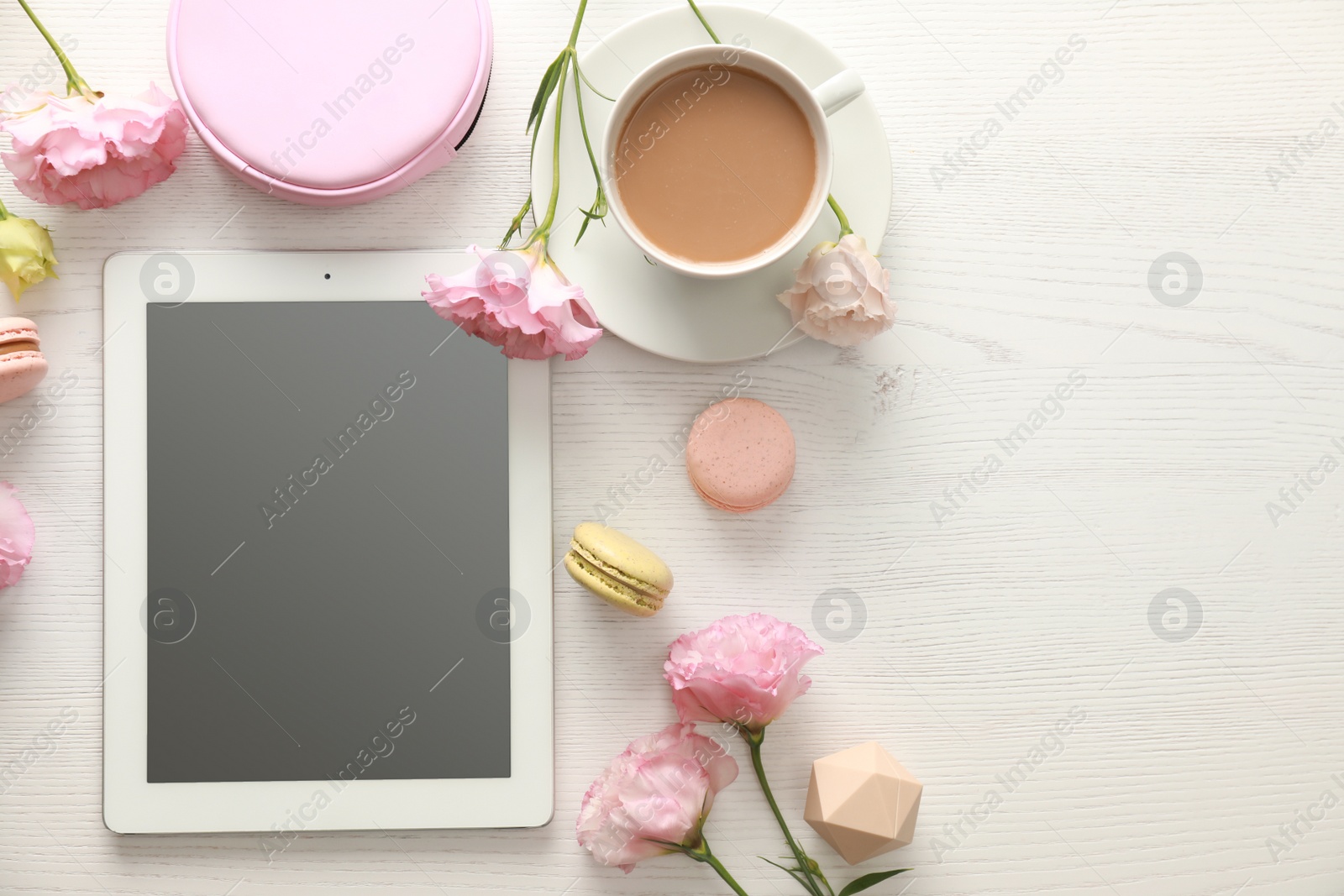 Photo of Flat lay composition with tablet on white wooden table, space for text. Fashion blogger