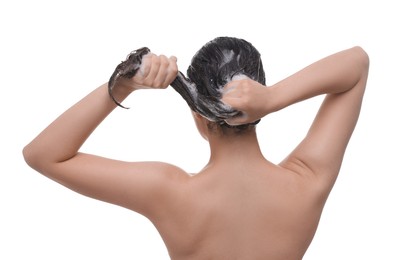 Photo of Woman washing hair on white background, back view