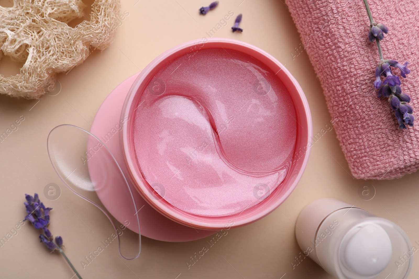 Photo of Flat lay composition with under eye patches on beige background. Cosmetic product