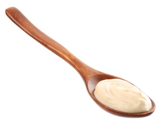 Photo of Wooden spoon with mayonnaise isolated on white