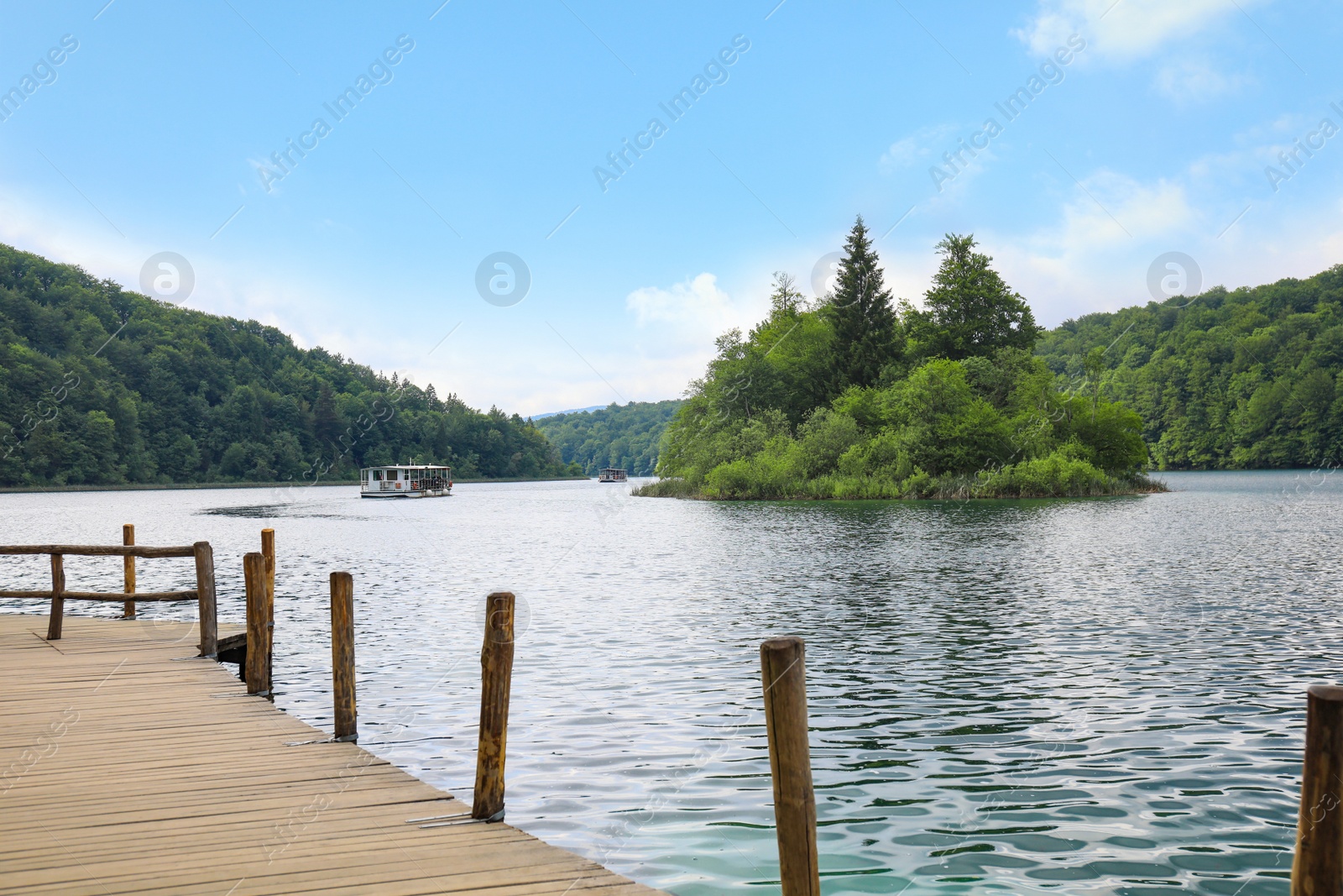 Photo of Picturesque view of beautiful river and  boats with tourists on sunny day