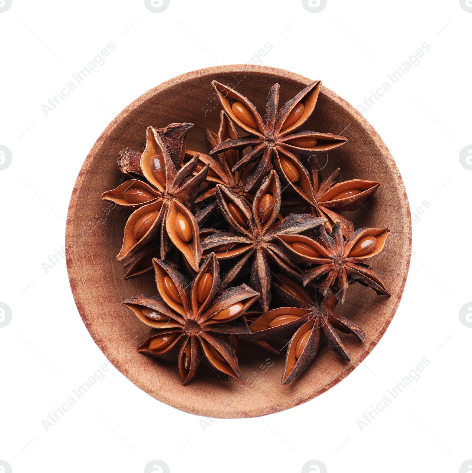 Photo of Aromatic anise stars in wooden bowl isolated on white, top view