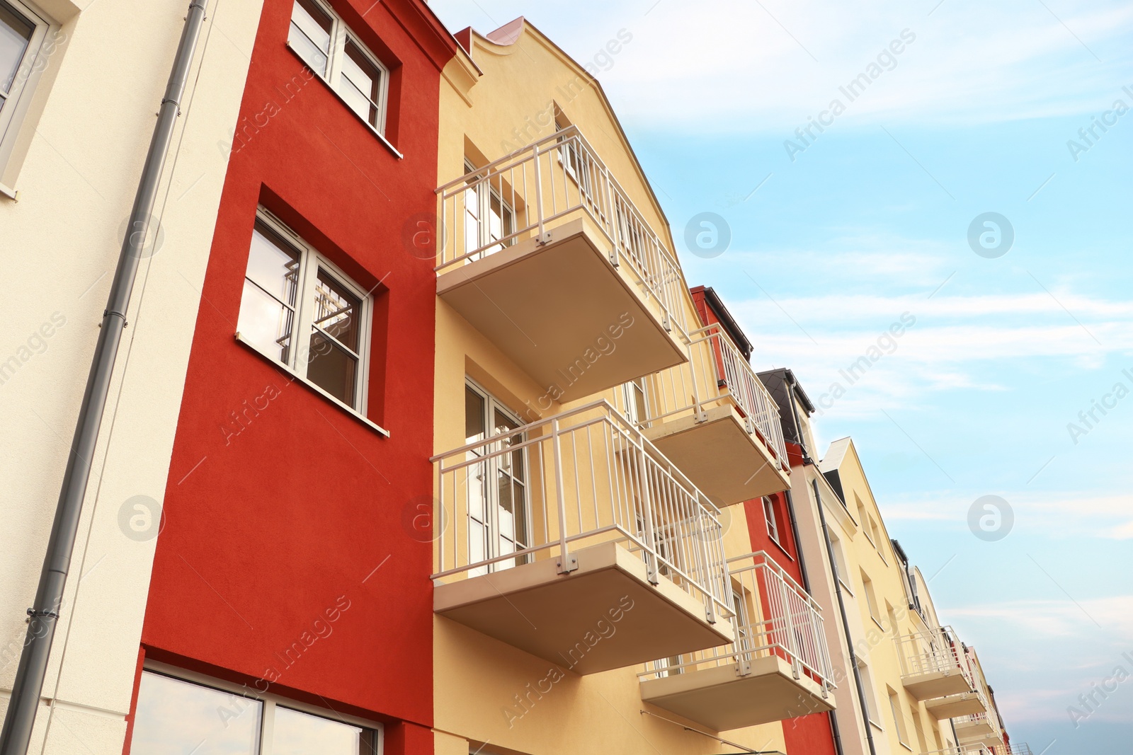 Photo of Exterior of beautiful building with empty balconies, low angle view