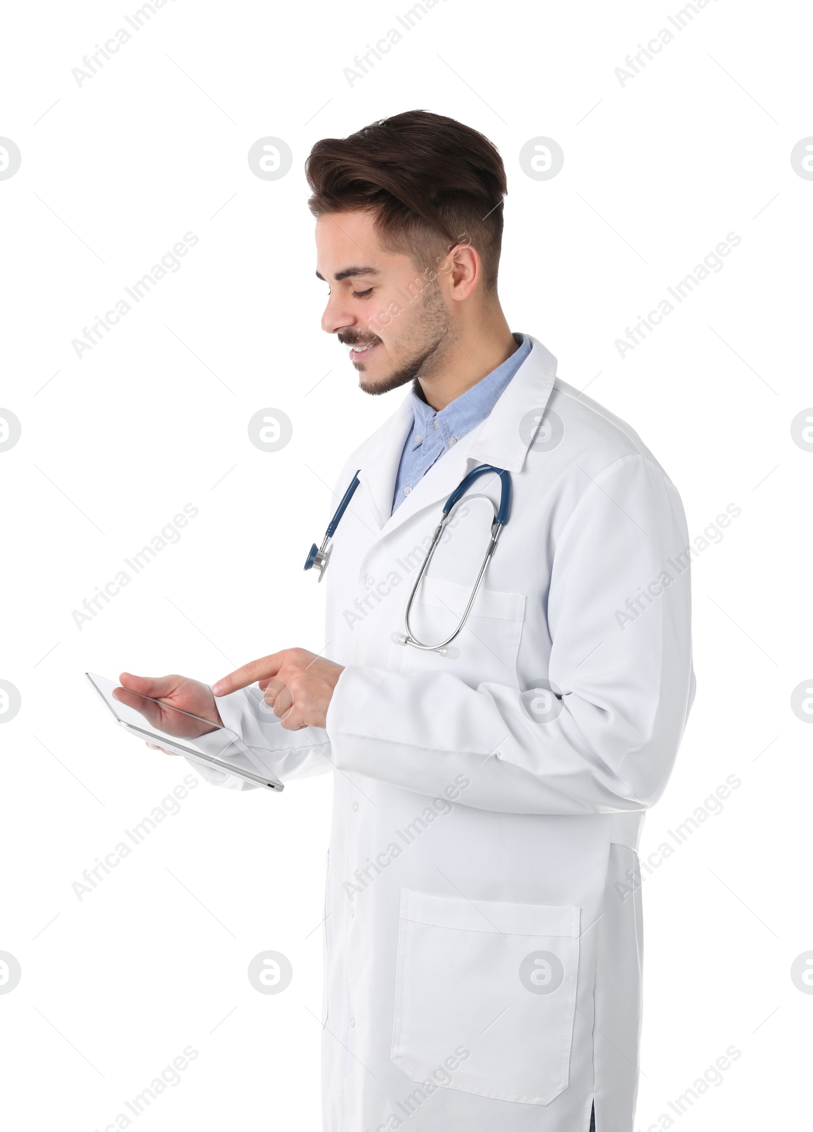Photo of Young medical student with tablet on white background