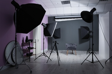 Photo of Interior of modern photo studio with professional equipment