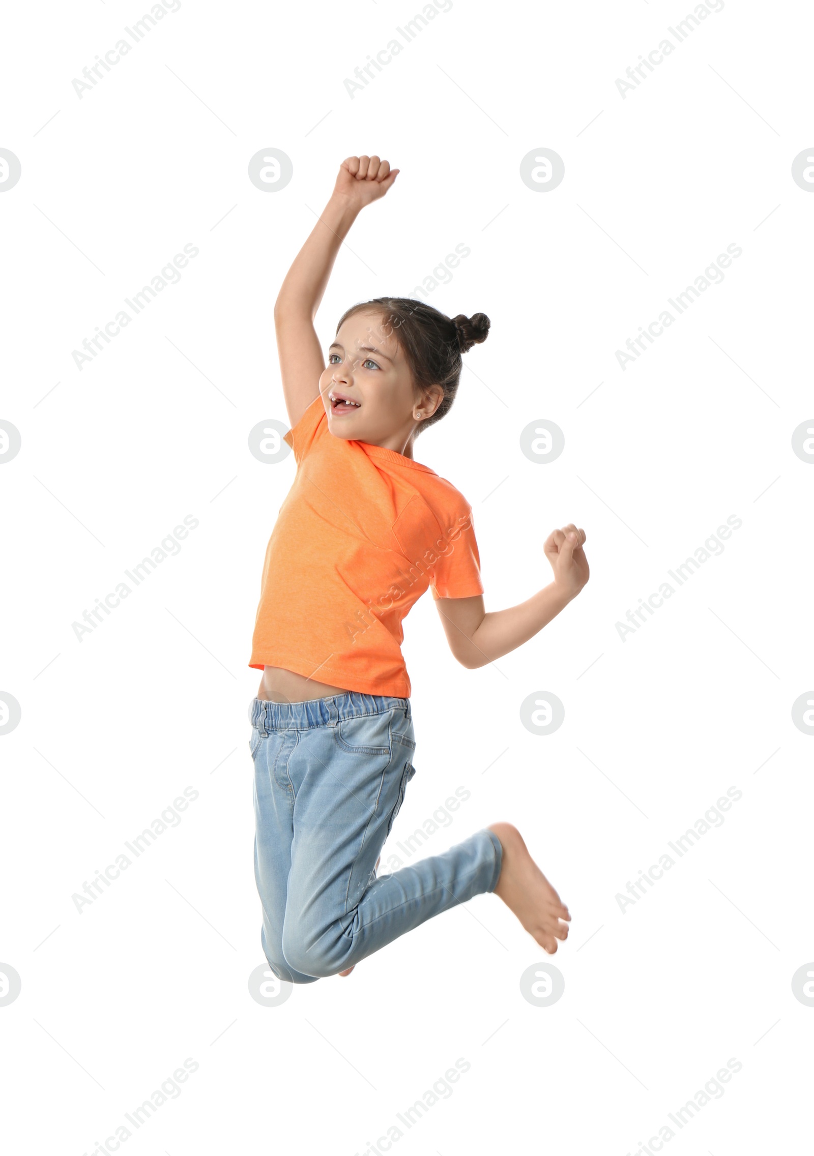 Photo of Cute little girl jumping on white background