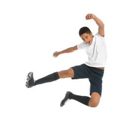 Teenage African-American boy playing football on white background