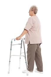 Photo of Full length portrait of elderly woman using walking frame isolated on white