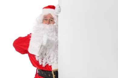 Man in Santa Claus costume posing on white background