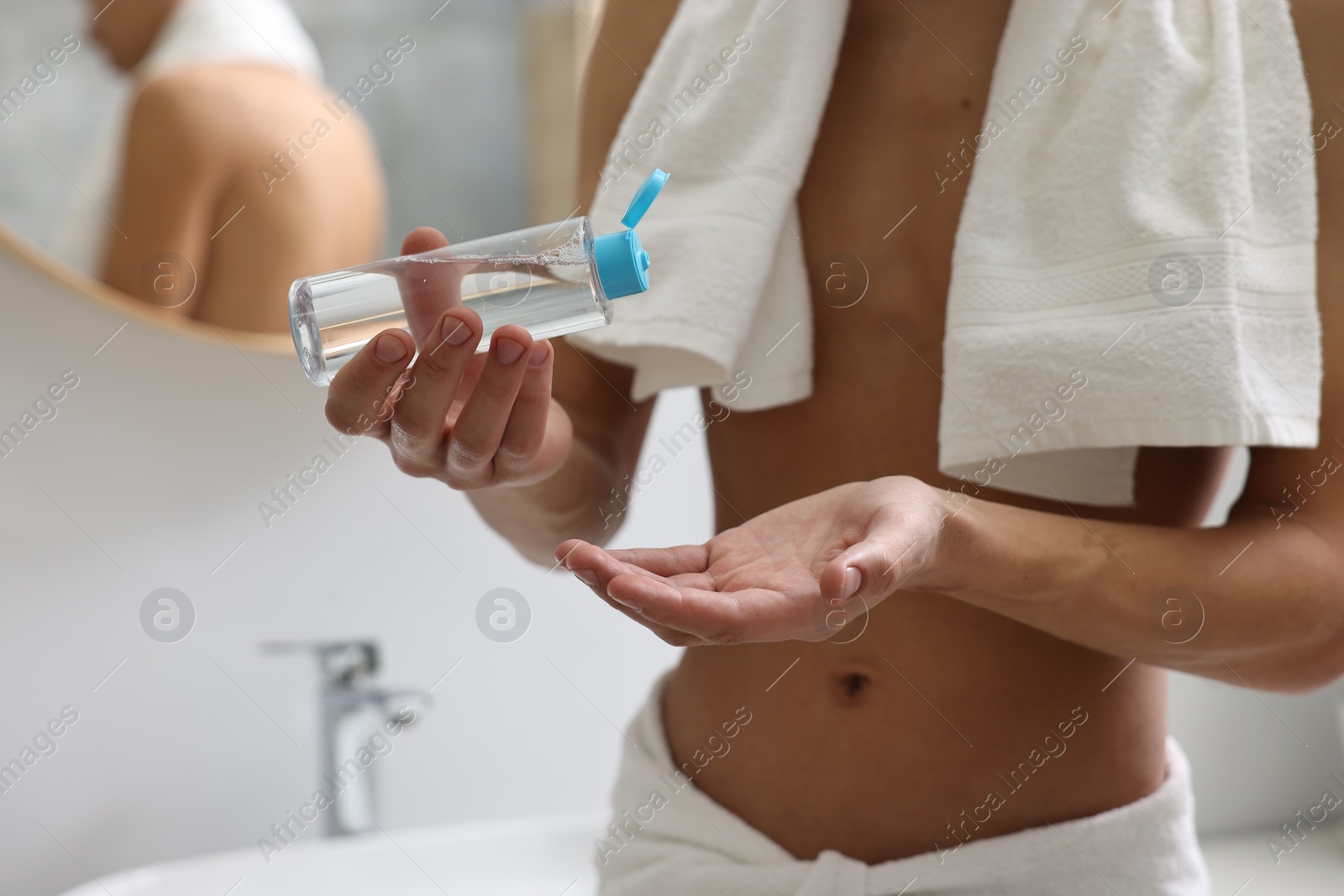 Photo of Man with lotion in bathroom, closeup view