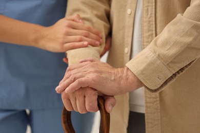 Health care and support. Nurse with elderly patient, closeup