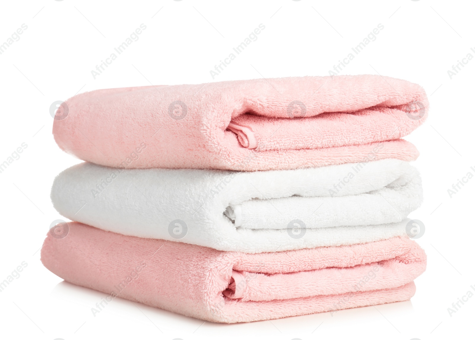 Photo of Folded soft terry towels on white background