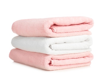 Folded soft terry towels on white background