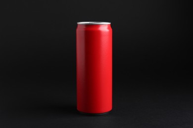 Photo of Energy drink in red can on black background