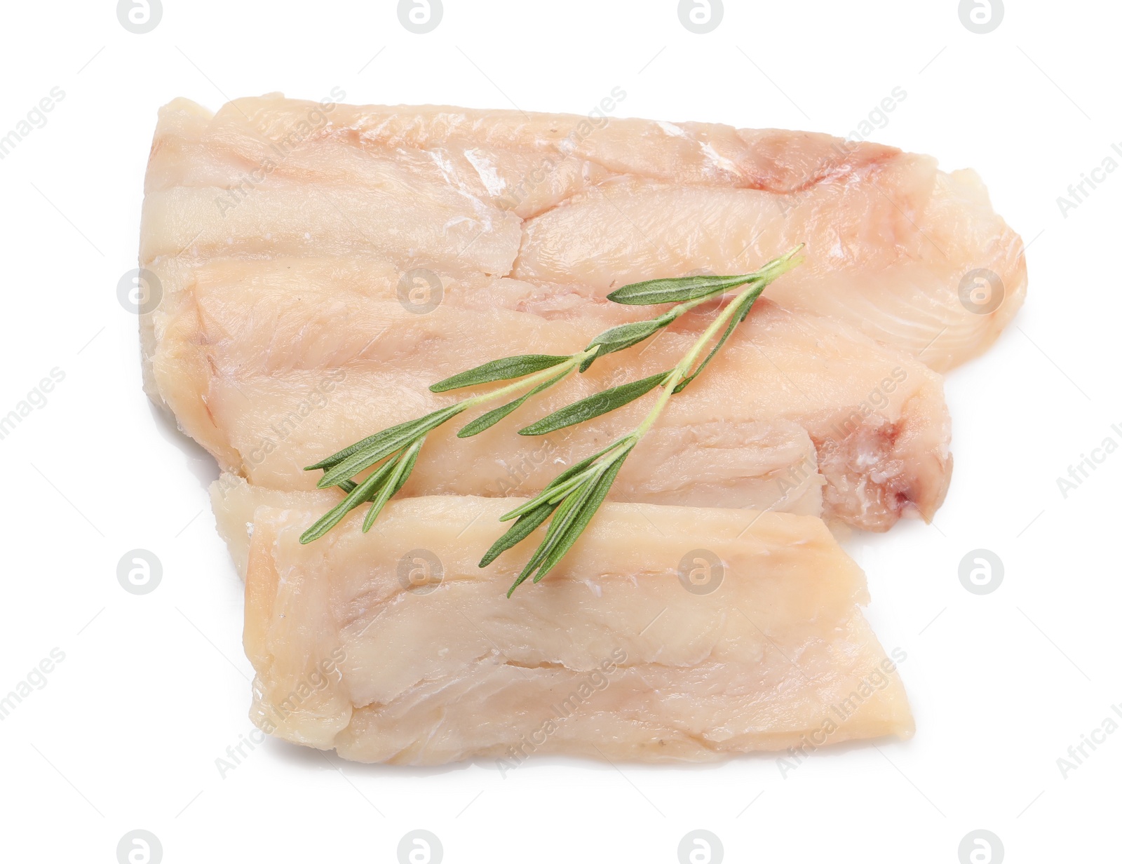 Photo of Pieces of raw cod fish and rosemary isolated on white