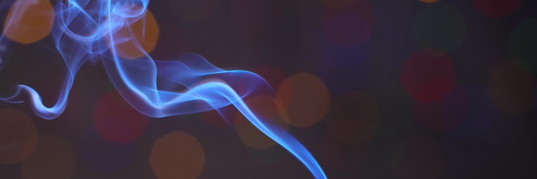 Image of Smoke against blurred lights, space for text. Banner design