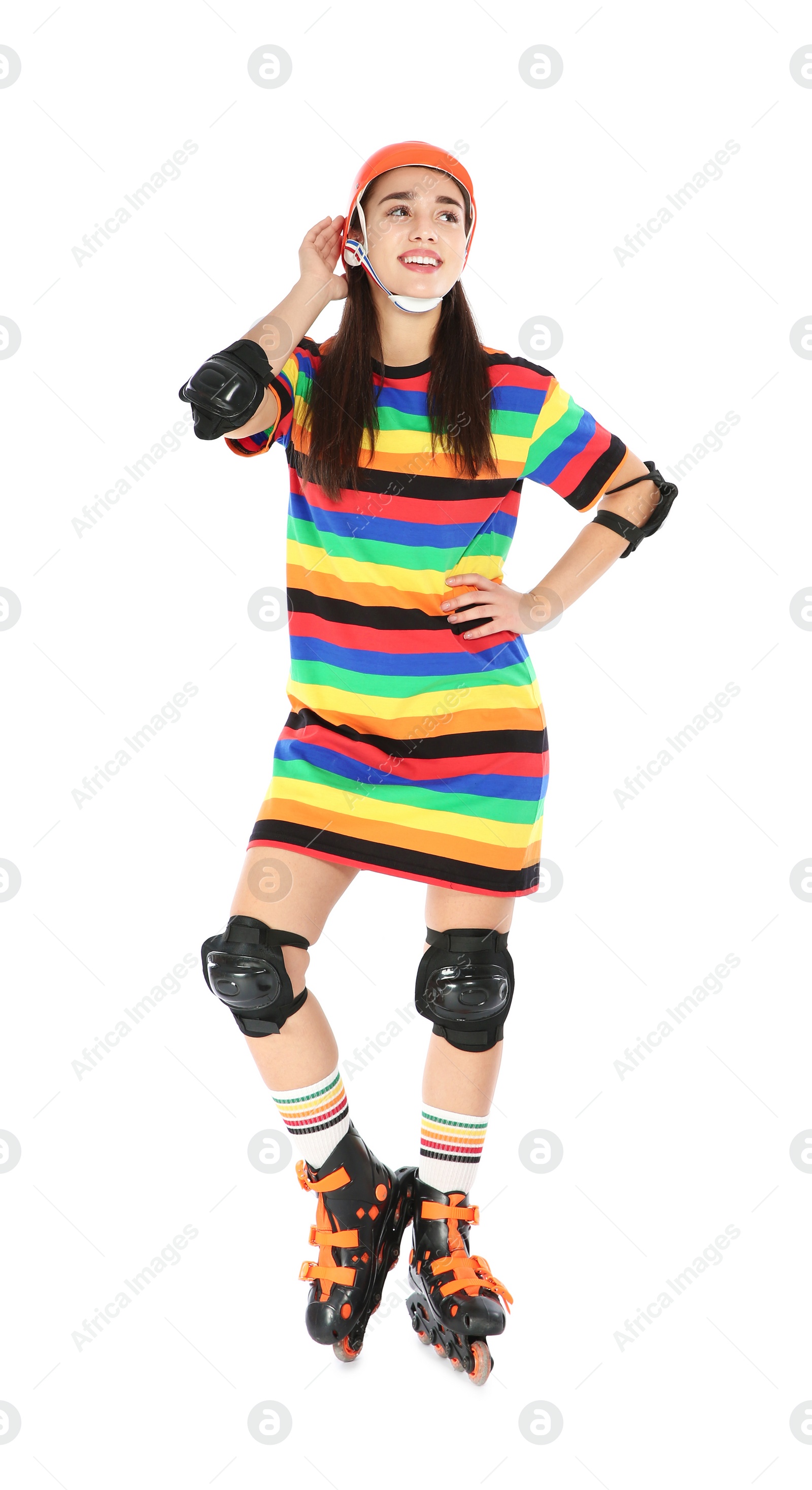 Photo of Full length portrait of young woman in bright dress with roller skates on white background