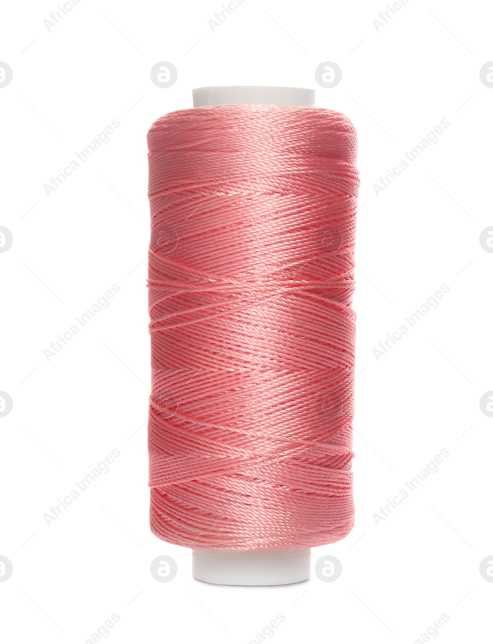 Photo of Spool of pink sewing thread isolated on white